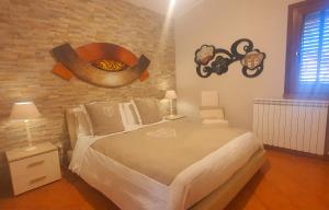 Un pat sau paturi într-o cameră la Palma Dello Zingaro