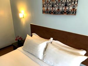 Postel nebo postele na pokoji v ubytování Hotel Maluri
