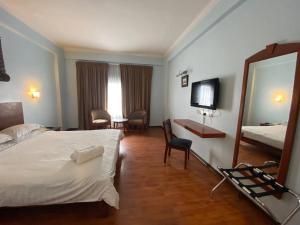 Postel nebo postele na pokoji v ubytování Hotel Maluri
