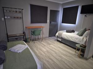 @241 Enkeldoorn Guesthouse客房内的一张或多张床位
