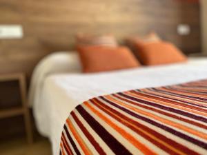 Postel nebo postele na pokoji v ubytování Hôtel Le Belvedere