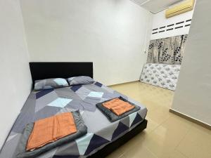 Katil atau katil-katil dalam bilik di Kampunghomestay Kuantan