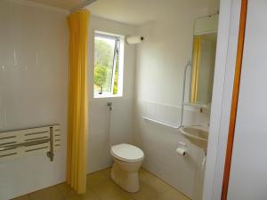 a bathroom with a toilet and a sink at The Healthy Guesthouse 