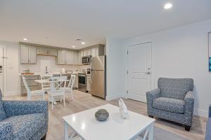 a living room with two chairs and a table at Harbourtown Suites, Unit 213 in Plymouth