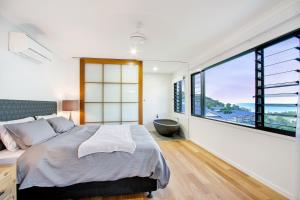 Ein Bett oder Betten in einem Zimmer der Unterkunft Elementa Whitsundays