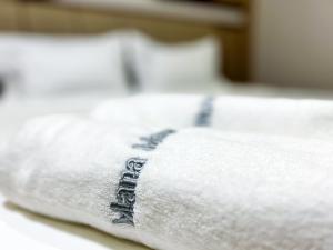 Postel nebo postele na pokoji v ubytování Mana Mana Hotel • Melaka •