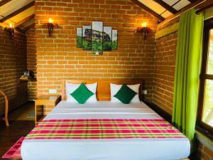 Letto o letti in una camera di Sungreen Cottage Sigiriya