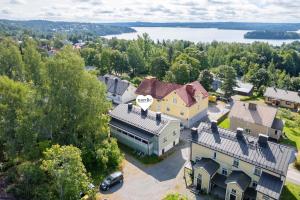 an aerial view of a house with a lake at Lovely Studio in Pispala in Tampere