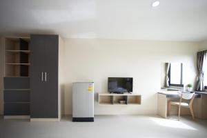TV a/nebo společenská místnost v ubytování Tone Condorent Hotel