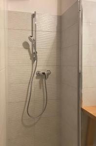 a shower with a glass door in a bathroom at Holiday Home Natura in Bovec