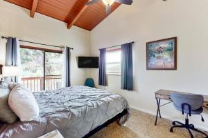 a bedroom with a bed and a desk and a window at Riverside Serenity - Unit A in Bradenton
