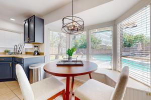a kitchen with a table and chairs and a dining room at Peachtree in Round Rock