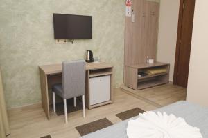 TV a/nebo společenská místnost v ubytování IPN ROOMs