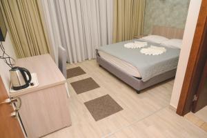 Postel nebo postele na pokoji v ubytování IPN ROOMs