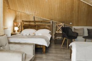 A bed or beds in a room at Dom Adonis