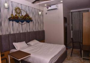 Voodi või voodid majutusasutuse Hotel Mahalaxmi Executive toas