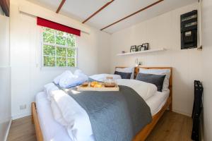 En eller flere senge i et værelse på 19, Close to Efteling & Safaripark Beekse Bergen+ PKG!