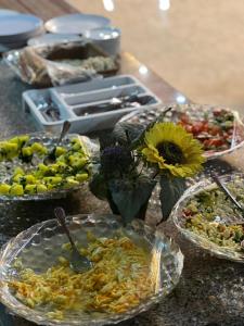 a table topped with plates of food on a table at Diamond Wadi Rum Luxury Camp in Wadi Rum