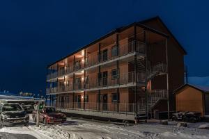 aominium building with a staircase in a parking lot at Longyearbyen Apartment in Longyearbyen