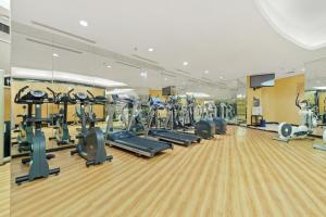 a gym with rows of treadmills and ellipticals at Soka by Kozystay - Mega Kuningan in Jakarta