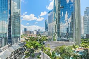 a view of a city skyline with tall buildings at Soka by Kozystay - Mega Kuningan in Jakarta