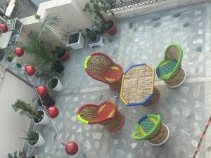 an overhead view of a group of chairs and a table at work stay enjoy outdoor party in Faridabad