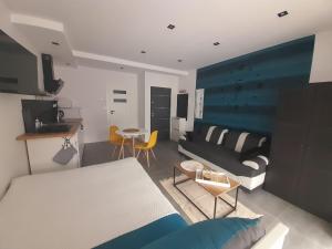 a living room with a couch and a table at Viva Apartments in Oświęcim