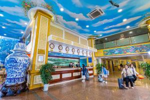 a lobby of a building with people waiting for their luggage at Hoang Son Peace Hotel in Ninh Binh +164 photos