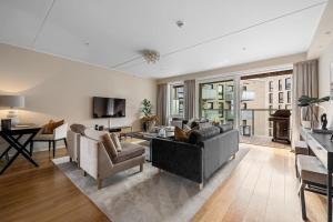 Μια τηλεόραση ή/και κέντρο ψυχαγωγίας στο Seafront Apartment at Sørengka OSLO