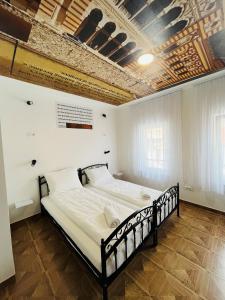 a bedroom with a large bed in a room at Sarajevo Stories Apartments Free Parking in Sarajevo