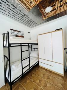 a room with two bunk beds and a ceiling at Sarajevo Stories Apartments Free Parking in Sarajevo