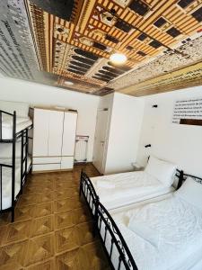a room with two bunk beds and a wooden floor at Sarajevo Stories Apartments Free Parking in Sarajevo