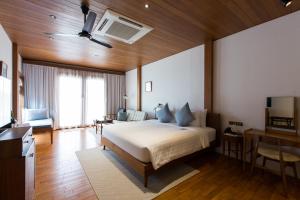 Un pat sau paturi într-o cameră la Chann Bangkok Noi