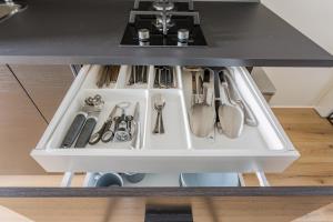 a drawer in a kitchen with utensils at Casa Luijben Zwaanshoek in Zwaanshoek