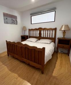 Katil atau katil-katil dalam bilik di Confortable T2 de 50 m2 avec patio et parking privé