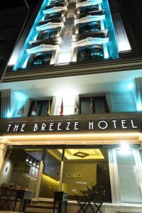 a building with a sign that reads the breeze hotel at The Breeze Hotel in Eskisehir