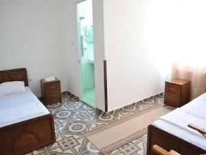 Postelja oz. postelje v sobi nastanitve SIRENA HOTEL