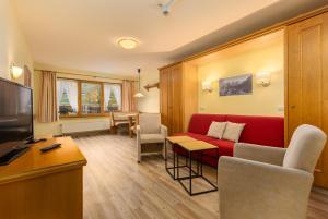 IFA Breitach Apartments Kleinwalsertalにあるテレビまたはエンターテインメントセンター