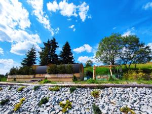 a rock garden in front of a house at Lesňanský sud in Oravská Lesná