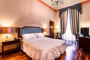 Postel nebo postele na pokoji v ubytování Phi Hotel Principe