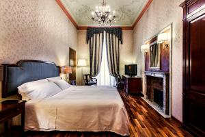 Postel nebo postele na pokoji v ubytování Phi Hotel Principe