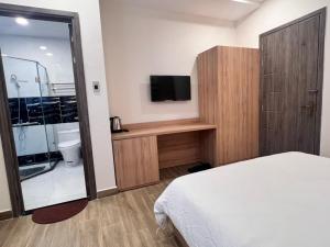 Postel nebo postele na pokoji v ubytování Q's House Dalat