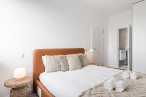 Una cama o camas en una habitación de GuestReady - A lovely vacation in Matosinhos
