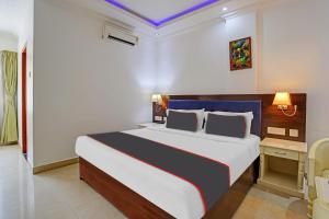 a bedroom with a large bed in a room at Rohini Hills in Punalūr