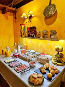 a table with a buffet of food on it at Casa Rural La Fuente del Jerte in Navaconcejo