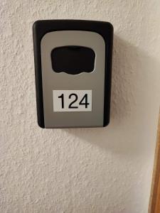an alarm clock on a wall in a room at Room in Guest room - Pension Forelle - double room no1 in Forbach
