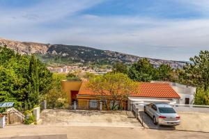a car parked in front of a house at Angie in Baška