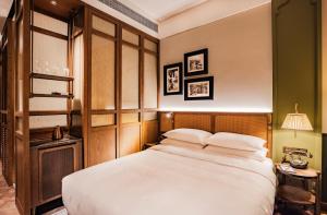 Voodi või voodid majutusasutuse Hotel Central 新中央酒店 toas