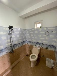 a bathroom that is being remodeled with a toilet at Mountain vibe ella in Ella