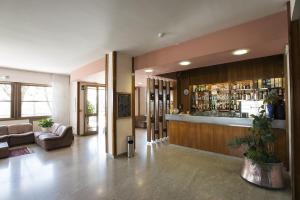 a lobby with a bar in a building at Albergo Rossana in Chianciano Terme